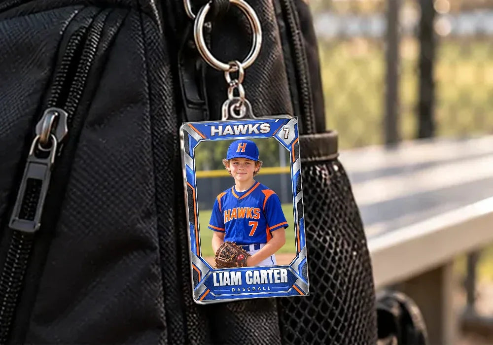 Liam's card as a keychain on a bat bag